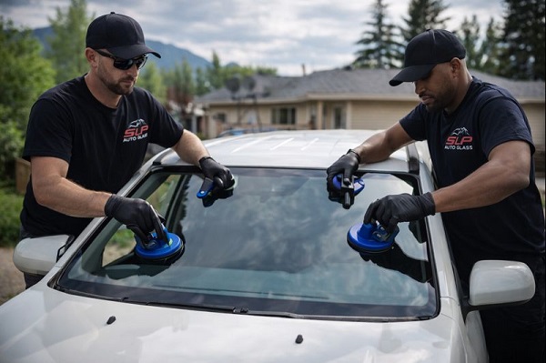 Suzuki auto glass replacement by SLP Auto Glass technicians installing a new windshield on-site