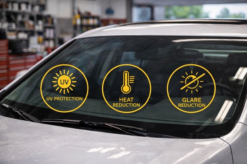 Tinted windshield reducing heat and glare while protecting vehicle interior after windshield replacement