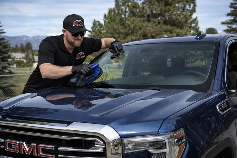 GMC windshield replacement performed by SLP Auto Glass technician on a GMC truck