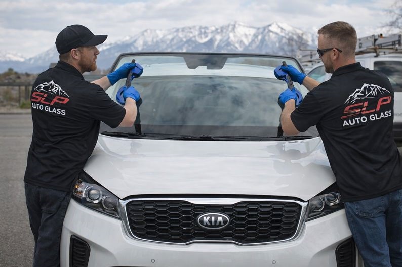 Kia Sorento windshield replacement performed by SLP Auto Glass technicians on site
