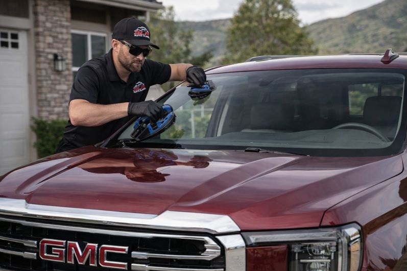 GMC windshield replacement by SLP Auto Glass technician on a GMC SUV